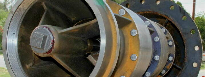 Detailed close-up of a pump mechanism being assembled, highlighting its heavy-duty construction.